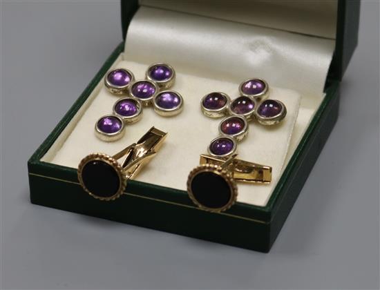 A pair of 9ct gold and black onyx cufflinks and a pair of silver and amethyst cross ear studs.